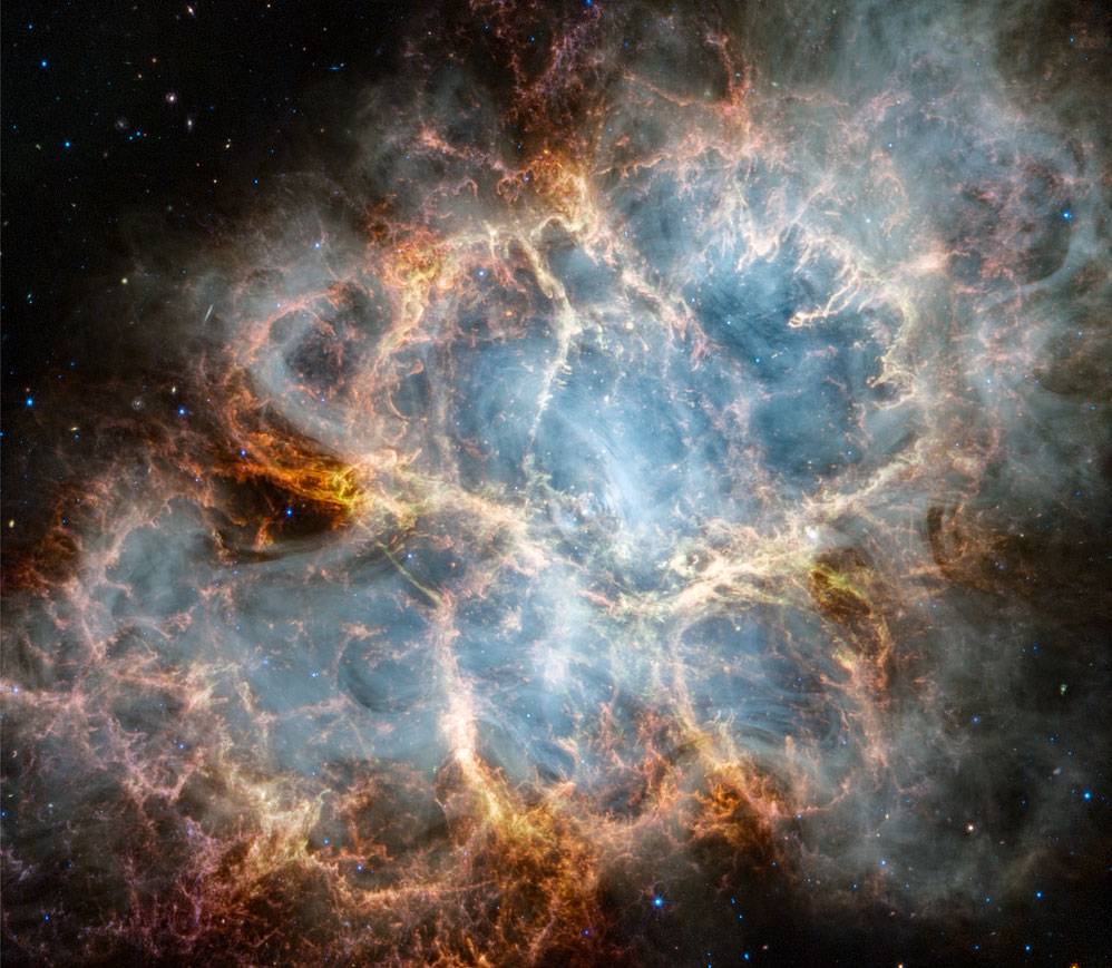 Na zdjęciu pokazano Mgławicę Krab, M1, w ujęciu Teleskopu
Kosmicznego Jamesa Webba (JWST). Po najechaniu kursora myszki
pokazuje się zdjęcie tej samej mgławicy, tym razem jednak
w ujęciu Teleskopu Kosmicznego Hubble'a (HST). Zdjęcie z Webba
wykonano w bliskiej podczerwieni, podczas gdy zdjęcie z Hubble'a
wykonano w świetle widzialnym.
Zobacz opis. Po kliknięciu obrazka załaduje się wersja
 o największej dostępnej rozdzielczości.